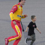 
              Joey Logano celebrates with his son Hudson after winning a NASCAR Cup Series auto race and championship Sunday, Nov. 6, 2022, in Avondale, Ariz. (AP Photo/Rick Scuteri)
            