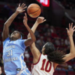 
              North Carolina forward Anya Poole, left, has a shot blocked by Iowa State center Stephanie Soares during the first half of an NCAA college basketball game in the Phil Knight Invitational in Portland, Ore., Sunday, Nov. 27, 2022. (AP Photo/Craig Mitchelldyer)
            