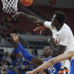 
              Oregon State center Chol Marial, top, blocks a shot by Duke forward Mark Mitchell (25) during the second half of an NCAA college basketball game in the Phil Knight Legacy tournament in Portland, Ore., Thursday, Nov. 24, 2022. (AP Photo/Craig Mitchelldyer)
            