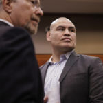 
              Cain Velasquez, right, appears for his arraignment with attorney Edward Sousa, who appeared with him, at the Santa Clara County Hall of Justice on Monday, Nov. 21, 2022, in San Jose, Calif. Velasquez, the former UFC champion based out of San Jose, was charged with shooting at a man accused of molesting his child. (Dai Sugano/Bay Area News Group via AP, Pool)
            