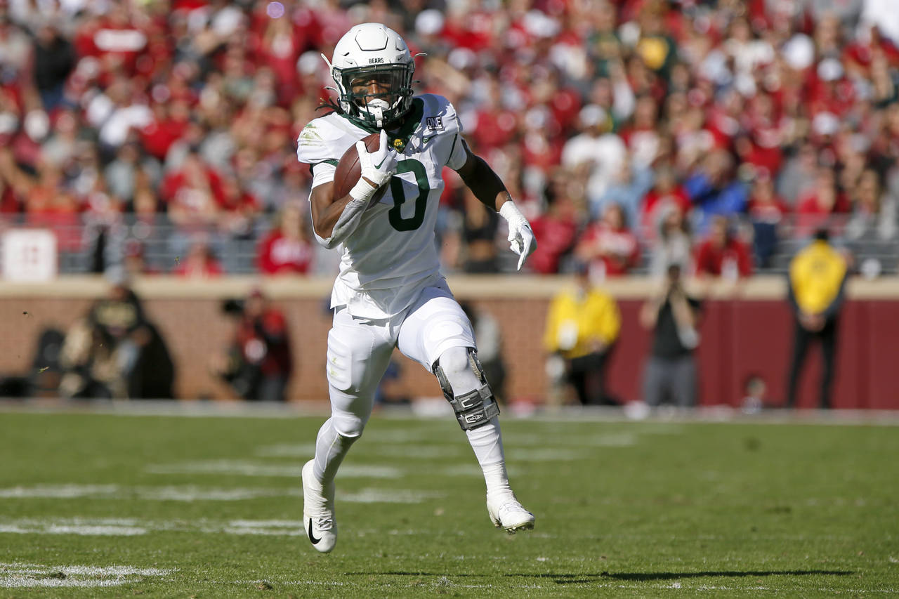 Baylor running back Craig Williams carries the ball against Oklahoma in the first half of an NCAA c...