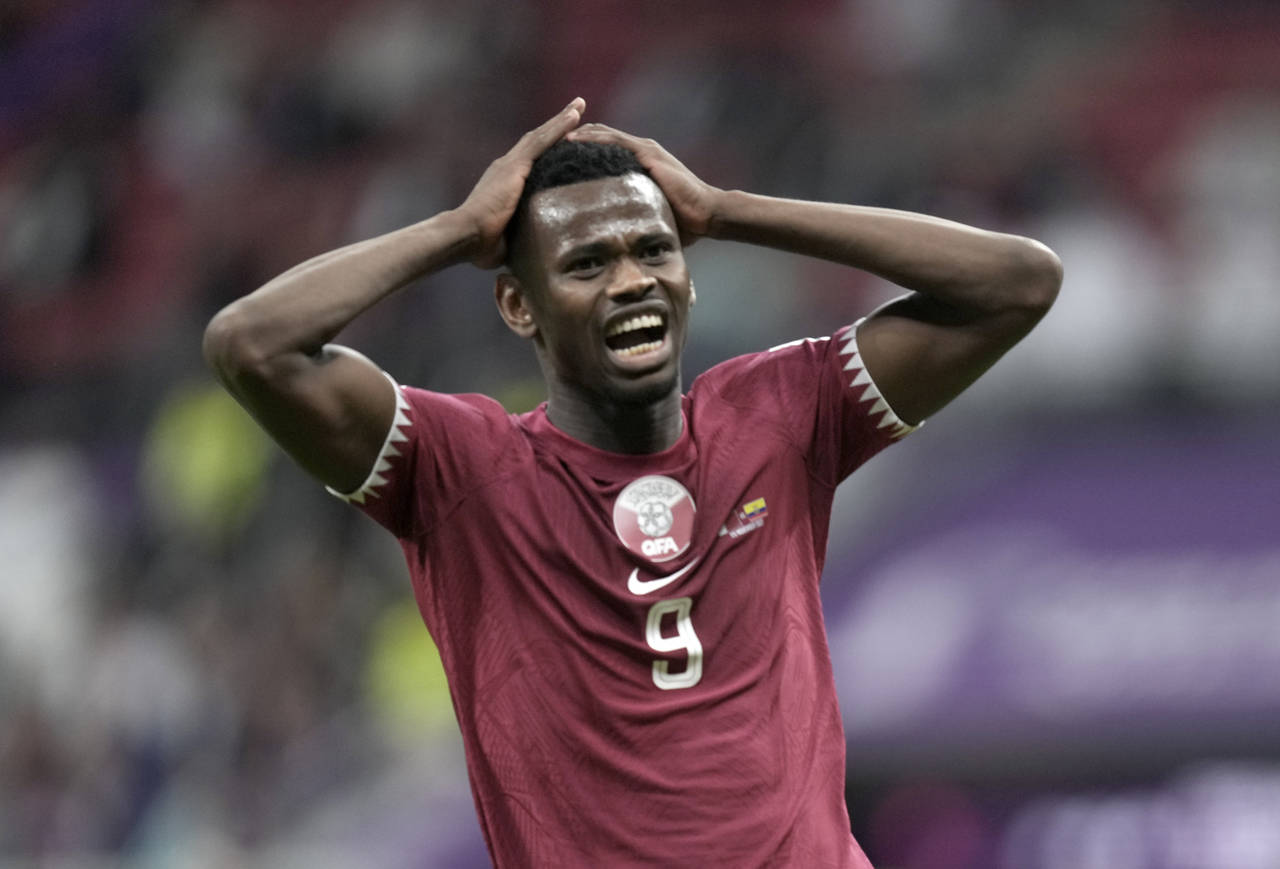Qatar's Mohammed Muntari reacts after missing a chance to score during the World Cup, group A socce...