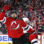
              New Jersey Devils left wing Tomas Tatar (90) reacts after scoring a goal against the Arizona Coyotes during the first period of an NHL hockey game, Saturday, Nov. 12, 2022, in Newark, N.J. (AP Photo/Noah K. Murray)
            
