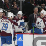 
              Colorado Avalanche center Nathan MacKinnon (29) is congratulated by teammates after scoring a goal against the Washington Capitals during the second period of an NHL hockey game Saturday, Nov. 19, 2022, in Washington. (AP Photo/Jess Rapfogel)
            