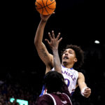
              Kansas forward Jalen Wilson (10) shoots over Texas Southern forward John Walker III (24) during the first half of an NCAA college basketball game Monday, Nov. 28, 2022, in Lawrence, Kan. (AP Photo/Charlie Riedel)
            