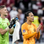 
              Virgil van Dijk of the Netherlands, right, and his teammate goalkeeper Andries Noppert of the Netherlands applaud at the end of the World Cup group A soccer match between the Netherlands and Qatar, at the Al Bayt Stadium in Al Khor , Qatar, Tuesday, Nov. 29, 2022. (AP Photo/Moises Castillo)
            