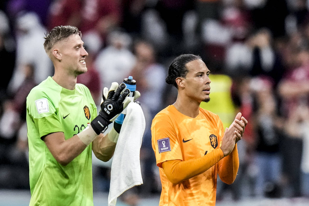 Virgil van Dijk of the Netherlands, right, and his teammate goalkeeper Andries Noppert of the Nethe...