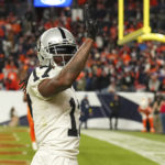 
              Las Vegas Raiders wide receiver Davante Adams (17) waves after scoring the winning touchdown against the Denver Broncos during overtime of an NFL football game in Denver, Sunday, Nov. 20, 2022. (AP Photo/Jack Dempsey)
            