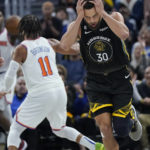 
              Golden State Warriors guard Stephen Curry (30) runs upcourt after scoring against the New York Knicks during the first half of an NBA basketball game in San Francisco, Friday, Nov. 18, 2022. (AP Photo/Jeff Chiu)
            