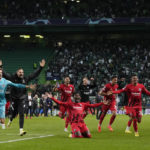 
              Frankfurt players celebrate after beating Sporting to quality for the next round after a Champions League group D soccer match between Sporting CP and Frankfurt at the Alvalade stadium in Lisbon, Tuesday, Nov. 1, 2022. (AP Photo/Armando Franca)
            