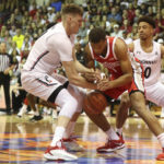 
              Cincinnati forward Viktor Lakhin and Ohio State guard Roddy Gayle Jr. (1) fight for a loose ball during the first half of an NCAA college basketball game, Tuesday, Nov. 22, 2022, in Lahaina, Hawaii. (AP Photo/Marco Garcia)
            