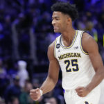 
              Michigan guard Jace Howard reacts after an NCAA college basketball game against Eastern Michigan, Friday, Nov. 11, 2022, in Detroit. (AP Photo/Carlos Osorio)
            