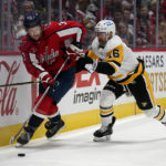 
              Washington Capitals defenseman Nick Jensen, left, skates with the puck as he is pressured by Pittsburgh Penguins left wing Jason Zucker in the third period of an NHL hockey game, Wednesday, Nov. 9, 2022, in Washington. (AP Photo/Patrick Semansky)
            