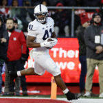 
              Penn State linebacker Kobe King scores a touchdown after recovering a Rutgers fumble during the first half of an NCAA college football game, Saturday, Nov. 19, 2022, in Piscataway, N.J. (AP Photo/Adam Hunger)
            