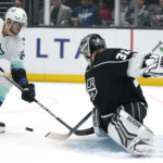 
              Seattle Kraken center Alex Wennberg, left, tries to score on Los Angeles Kings goaltender Jonathan Quick during the first period of an NHL hockey game Tuesday, Nov. 29, 2022, in Los Angeles. (AP Photo/Mark J. Terrill)
            