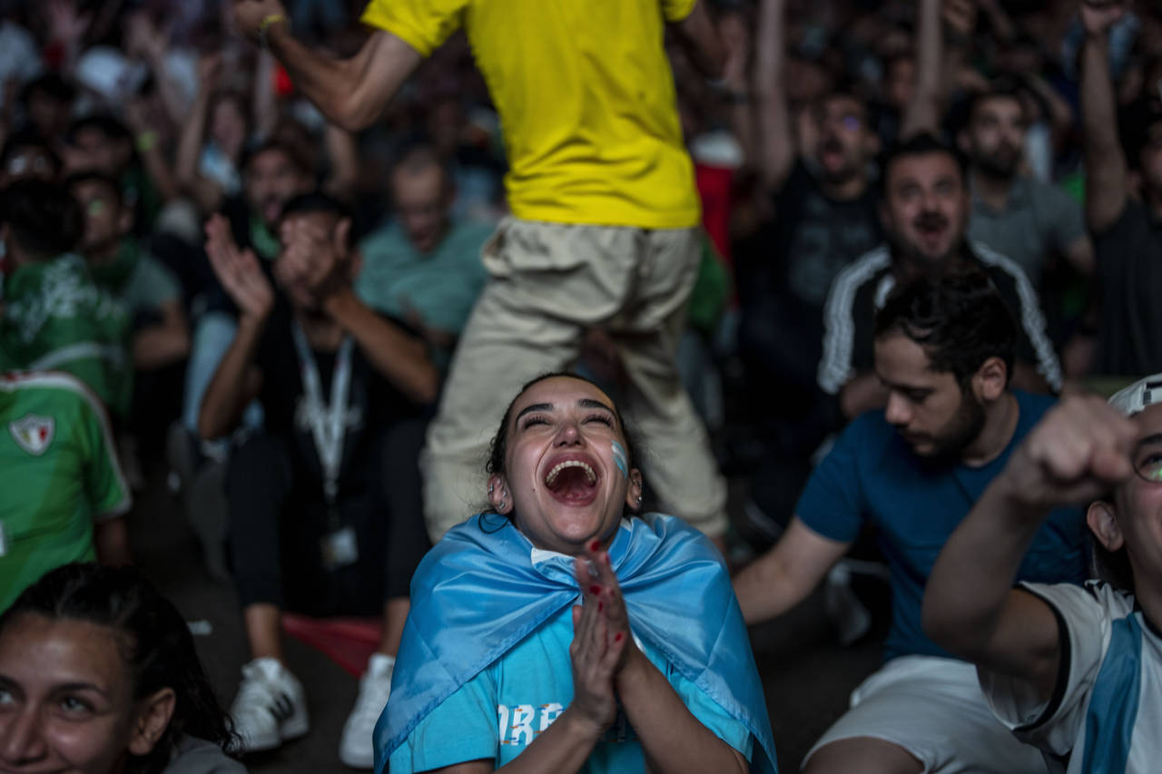 A fan of Argentina reacts after Argentina's Lionel Messi scores his side's opening goal against Mex...