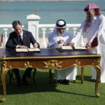 
              United States Secretary of State Antony Blinken, left, and Qatar Foreign Minister Mohammed Bin Adbulrahman Al Thani, center right, sign a letter of intent during a media event at the Diplomatic Club, in Tuesday, Nov. 22, 2022. America's top diplomat criticized a decision by FIFA to threaten players at the World Cup with yellow cards if they wear armbands supporting inclusion and diversity. (AP Photo/Ashley Landis)
            