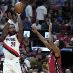 
              Portland Trail Blazers forward Justise Winslow (26) takes a shot against Miami Heat guard Kyle Lowry (7) during the first half of an NBA basketball game, Monday, Nov. 7, 2022, in Miami. (AP Photo/Wilfredo Lee)
            