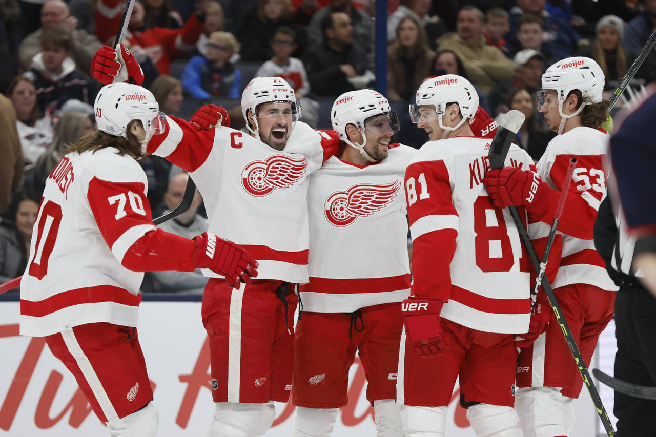 Detroit Red Wings players celebrate their goal against the Columbus Blue Jackets during the first p...