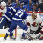 
              Ottawa Senators goaltender Anton Forsberg (31) makes a save on a shot by Tampa Bay Lightning center Brayden Point (21) during the first period of an NHL hockey game Tuesday, Nov. 1, 2022, in Tampa, Fla. (AP Photo/Chris O'Meara)
            