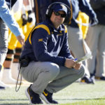 
              West Virginia head coach Neal Brown watches from the sideline during the first half of an NCAA college football game against Iowa State, Saturday, Nov. 5, 2022, in Ames, Iowa. (AP Photo/Charlie Neibergall)
            