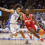 
              Ohio State's Bruce Thornton (2) handles the ball as Duke's Tyrese Proctor (5) defends during the first half of an NCAA college basketball game in Durham, N.C., Wednesday, Nov. 30, 2022. (AP Photo/Ben McKeown)
            