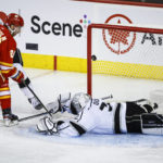 
              Los Angeles Kings goalie Jonathan Quick, right, is scored on by Calgary Flames forward Elias Lindholm during the second period of an NHL hockey game in Calgary, Alberta, Monday, Nov. 14, 2022. (Jeff McIntosh/The Canadian Press via AP)
            