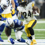 
              Pittsburgh Steelers' Benny Snell Jr. (24) runs past Indianapolis Colts' Bobby Okereke (58) during the first half of an NFL football game, Monday, Nov. 28, 2022, in Indianapolis. (AP Photo/AJ Mast)
            