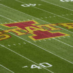 
              The Iowa State logo is seen on the field before an NCAA college football game against West Virginia, Saturday, Nov. 5, 2022, in Ames, Iowa. College athletic programs of all sizes are reacting to inflation the same way as everyone else. They're looking for ways to save. Travel and food are the primary areas with increased costs. (AP Photo/Charlie Neibergall)
            