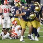 
              Notre Dame defensive lineman Howard Cross III takes a bow after sacking Clemson quarterback DJ Uiagalelei during the first half of an NCAA college football game Saturday, Nov. 5, 2022, in South Bend, Ind. (AP Photo/Charles Rex Arbogast)
            
