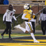
              Missouri wide receiver Luther Burden III, right, scores a touchdown in front of New Mexico State defensive back Linwood Crump, left, during the third quarter of an NCAA college football game Saturday, Nov. 19, 2022, in Columbia, Mo. (AP Photo/L.G. Patterson)
            