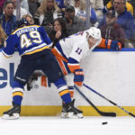 
              New York Islanders' Zach Parise (11) is checked by St. Louis Blues' Ivan Barbashev (49) during the second period of an NHL hockey game Thursday, Nov. 3, 2022, in St. Louis. (AP Photo/Jeff Le)
            