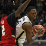 
              Austin Peay guard Elijah Perkins (2) defends Purdue guard Brandon Newman (5) during an NCAA college basketball game Friday, Nov. 11, 2022, in West Lafayette, Ind. (Alex Martin/Journal & Courier via AP)
            