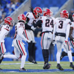 
              Georgia defensive back Kelee Ringo (5) celebrates intercepting a pass against Kentucky during the first half of an NCAA college football game in Lexington, Ky., Saturday, Nov. 19, 2022. (AP Photo/Michael Clubb)
            