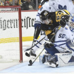 
              Pittsburgh Penguins right wing Rickard Rakell (67) is stopped by Toronto Maple Leafs goalie Erik Kallgren (50) during the second period of a hockey game, Saturday, Nov. 26, 2022, in Pittsburgh. (AP Photo/Philip G. Pavely)
            