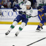 
              Vancouver Canucks center Elias Pettersson (40) passes the puck during the second period of an NHL hockey game against the Buffalo Sabres, Tuesday, Nov. 15, 2022, in Buffalo, N.Y. (AP Photo/Jeffrey T. Barnes)
            