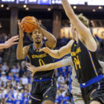 
              UC Riverside's Kyle Owens (0) makes a pass to Wil Tattersall (14) during the first half of the team's NCAA college basketball game against Creighton on Thursday, Nov. 17, 2022, in Omaha, Neb. (AP Photo/John Peterson)
            