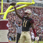 
              Florida State wide receiver Malik McClain (11) celebrates his touchdown during the first half of an NCAA college football game against Louisiana on Saturday, Nov. 19, 2022, in Tallahassee, Fla. (AP Photo/Gary McCullough)
            