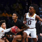 
              Arizona State's Austin Nunez (2) and DJ Horne (0) defend Virginia Commonwealth's Zeb Jackson during the second half of an NCAA college basketball game at the Legends Classic Wednesday, Nov. 16, 2022, in New York. Arizona State won 63-59. (AP Photo/Frank Franklin II)
            