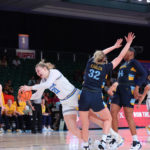 
              In a photo provided by Bahamas Visual Services, UCLA's Lina Sontag (21) goes up against Marquette's Liza Karlen (32) during the NCAA college basketball championship game in the Battle 4 Atlantis at Paradise Island, Bahamas, Monday, Nov. 21, 2022. (Tim Aylen/Bahamas Visual Services via AP)
            