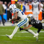 
              Indianapolis Colts running back Jonathan Taylor (28) is tackled by Las Vegas Raiders linebacker Luke Masterson (59) in the first half of an NFL football game in Las Vegas, Sunday, Nov. 13, 2022. (AP Photo/Matt York)
            