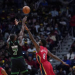 
              Boston Celtics guard Jaylen Brown (7) shoots against New Orleans Pelicans forward Naji Marshall (8) in the first half of an NBA basketball game in New Orleans, Friday, Nov. 18, 2022. (AP Photo/Gerald Herbert)
            