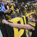 
              Pittsburgh Steelers linebacker T.J. Watt (90) hands his gloves to a fan following an NFL football game against the New Orleans Saints in Pittsburgh, Sunday, Nov. 13, 2022. (AP Photo/Don Wright)
            