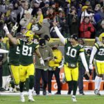 
              Green Bay Packers' Johnathan Abram (44), Josiah Deguara (81), Jordan Love (10) Rasul Douglas (29) and others celebrate the team's 31-28 win in overtime of an NFL football game against the Dallas Cowboys Sunday, Nov. 13, 2022, in Green Bay, Wis. (AP Photo/Mike Roemer)
            