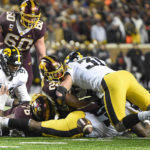 
              Minnesota running back Mohamed Ibrahim, second from right, fumbles the ball as he is hit by Iowa linebacker Jack Campbell (31) during the second half an NCAA college football game on Saturday, Nov. 19, 2022, in Minneapolis. The hit resulted in a turnover. (AP Photo/Craig Lassig)
            