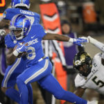
              Air Force wide receiver DeAndre Hughes, left, drives past Colorado State linebacker Dequan Jackson in the first half of an NCAA college football game Saturday, Nov. 19, 2022, at Air Force Academy, Colo. (AP Photo/David Zalubowski)
            