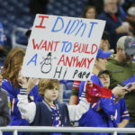 
              A Buffalo Bills fan holds a poster during pregame of an NFL football game against the Cleveland Browns, Sunday, Nov. 20, 2022, in Detroit. The game was originally scheduled to be played in Buffalo but was moved to Detroit because of the blizzard. (AP Photo/Duane Burleson)
            