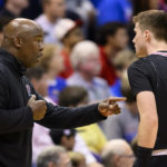 
              Omaha head coach Chris Crutchfield talks to guard Tony Osburn (32) during the first half of an NCAA college basketball game against Kansas in Lawrence, Kan., Monday, Nov. 7, 2022. (AP Photo/Reed Hoffmann)
            