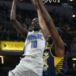 
              Orlando Magic center Bol Bol (10) shoots around Indiana Pacers center Myles Turner during the first half of an NBA basketball game in Indianapolis, Saturday, Nov. 19, 2022. (AP Photo/AJ Mast)
            