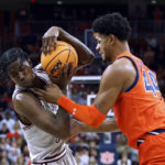
              Texas Southern forward Joirdon Karl Nicholas, left, tries to keep the ball from Auburn center Dylan Cardwell during the first half of an NCAA college basketball game Friday, Nov. 18, 2022, in Auburn, Ala. (AP Photo/Butch Dill)
            